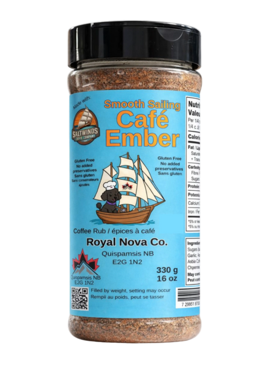 A bottle of Royal Nova Co. Smooth Sailing Cafe Ember coffee rub spice rub, featuring a light blue label with a cartoon sailing ship and a black cap, set against a black background.